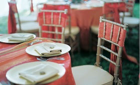 Indian-Inspired Guest Table
Photography: MBV Photography
Read More:
http://www.insideweddings.com/weddings/asian-inspired-summer-wedding-in-the-hills-of-north-carolina/159/ Red and orange tablecloth and chair cover