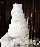 White Wedding Cake with Geode Base
Photography: Perez Photography
Read More:
http://www.insideweddings.com/weddings/incredible-tented-ceremony-barn-reception-at-ranch-in-aspen/860/ White wedding cake with fresh orchids and geode crystal bottom layer and cake table black champagne