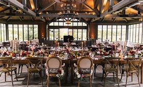 Rustic Reception Space in Barn
Photography: Vue Photography
Read More:
http://www.insideweddings.com/weddings/baroque-autumn-wedding-with-deep-wine-tones-in-north-carolina/770/ rustic old-europe themed reception hall with tall windows wooden beams and signs better together