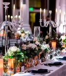 Crystal Candelabra on Long Reception Table
Photography: Kim Fox Photography
Read More:
http://www.insideweddings.com/weddings/luxe-vintage-inspired-winter-wedding-in-downtown-los-angeles/1082/ Long wedding reception tables with crystal candelabra greenery white flowers feathers black napkins