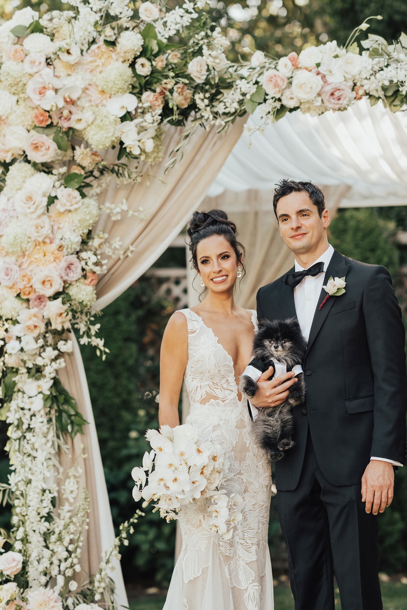 Bride %26 Groom with Pomeranian
Photography: Sam %26 Sola Lee Photography
Read More:
http://www.insideweddings.com/weddings/modern-outdoor-ceremony-tent-reception-in-seattle-on-puget-sound/1309/ bride and groom under chuppah with little pomeranian pup dog puppy in tuxedo outfit