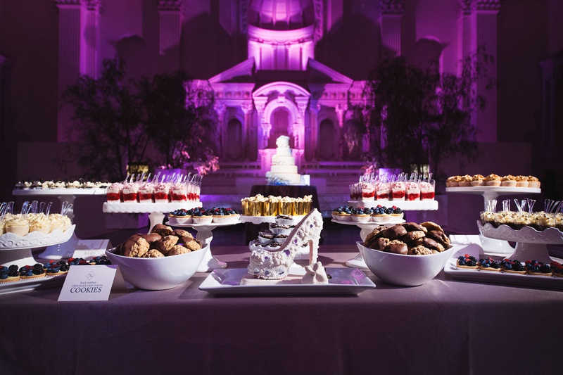 Dessert Bar %26 Wedding Cake
Photography: Callaway Gable
Read More:
http://www.insideweddings.com/weddings/modern-in-the-round-ceremony-whimsical-garden-inspired-reception/1155/ Vibiana wedding reception purple lighting shoe dessert dessert sweets bar candy bar alternative