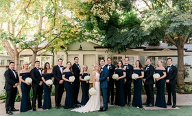 Bridal Party at Santa Monica Hotel
Photography: Valorie Darling Photography
Read More:
http://www.insideweddings.com/weddings/santa-monica-wedding-with-tropical-touches-east-coast-inspiration/1232/ groom in blue suit with bride bridesmaids in navy blue off shoulder gowns groomsmen in suits bow tie