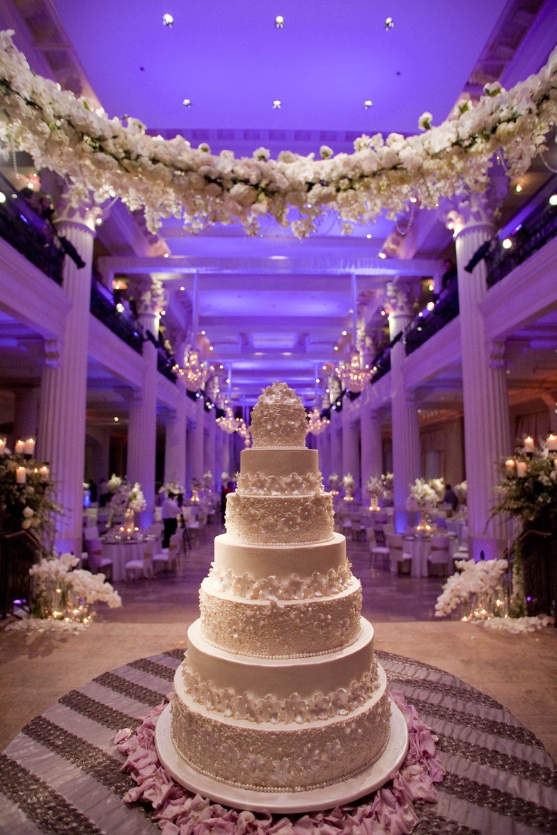 Floral-Embellished Cake
Photography: Michael Carr Photography
Read More:
http://www.insideweddings.com/weddings/exceptional-wedding-event-in-historical-houston-building/468/ White wedding cake under garland of white flowers
