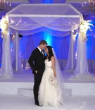 Blue Ceremony Lighting
Photography: KingenSmith
Read More:
http://www.insideweddings.com/weddings/timeless-black-white-wedding-in-chicago-illinois/349/ Bride and groom in front of chuppah at Chicago wedding