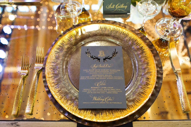 Gold Charger with Antler Menu Design
Photography: Perez Photography
Read More:
http://www.insideweddings.com/weddings/incredible-tented-ceremony-barn-reception-at-ranch-in-aspen/860/ Gold forks and knife gold charger plate grey menu card with laser cut antler details and gold letter