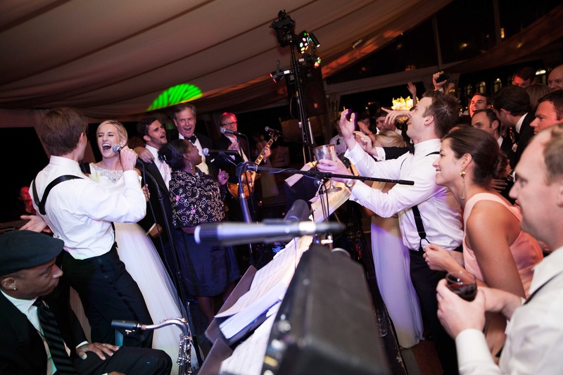 Bride and Groom Join Band Onstage
Photography: Michael Bambino %26 Co.
Read More:
http://www.insideweddings.com/weddings/whimsical-open-air-secret-garden-wedding-with-soft-spring-hues/777/ a fun loving bride and groom join their reception band onstage to sing a song