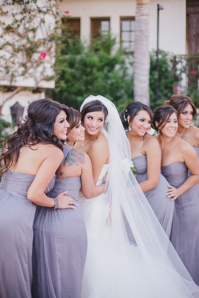 Lavender Bridesmaid Dresses
Photography: Jasmine Star Photography
Read More:
http://www.insideweddings.com/weddings/spanish-style-ceremony-outdoor-ranch-wedding-reception/504/ Bride smiling with bridesmaids in purple strapless dresses