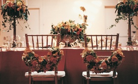 Bride and Groom Seating
Photography: Katherine Lasford
Read More:
http://www.insideweddings.com/weddings/victorian-theme-home-wedding-in-vancouver-british-columbia/119/ Floral garlands on backs of bride and groom dinner chairs