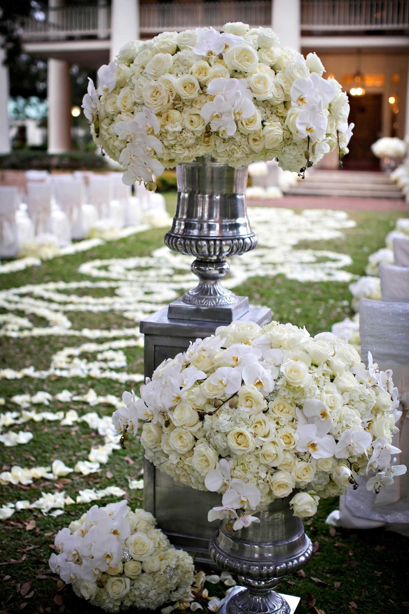 Ceremony Décor Photos White Flower Arrangement in Silver Urn Inside Weddings