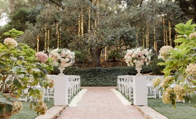 Aisle Leading to Tree
Photography: Jenny Quicksall Photography
Read More:
http://www.insideweddings.com/weddings/romantic-wedding-with-blush-and-ivory-decor-in-malibu-california/1146/ calamigos ranch wedding, twinkle lights suspended from tree