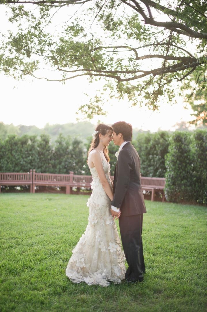 Georgia Wedding Couple
Photography: Harwell Photography
Read More:
http://www.insideweddings.com/weddings/romantic-woodland-inspired-atlanta-wedding-with-natural-details/433/ Bride with Asian American groom in grass park