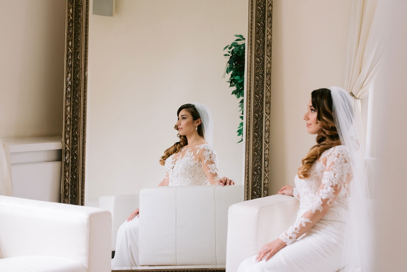 Bride Reflected in Mirror
Photography: Kesha Lambert Photography
Read More:
http://www.insideweddings.com/weddings/personalized-ceremony-with-pink-florals-at-a-loft-in-new-york-city/1210/ bride in lace long sleeve pronovias dress, bride reflected in mirror