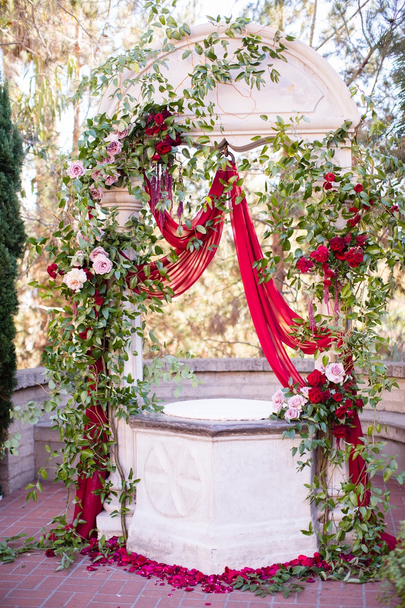 Ceremony Altar with Scarlet Drapery
Photography: Acqua Photo
Read More:
http://www.insideweddings.com/weddings/balboa-park-wedding-with-wine-inspired-color-scheme-in-san-diego/948/ ceremony altar with scarlet drapery, roses, greenery