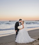 Kiss by the Ocean at Sunset
Photography: Willa Kveta Photography
Read More:
http://www.insideweddings.com/weddings/outdoor-ceremony-lively-reception-with-lush-white-floral-decor/1083/ bride in full ruffled ball gown, groom in tuxedo, bride and groom kiss on beach at sunset