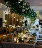 Head Table with Lush Greenery Overhead
Photography: Studio This Is
Read More:
http://www.insideweddings.com/weddings/traditional-catholic-ceremony-elegant-reception-in-chicago/1206/ wedding reception greenery over long tables wedding cake chandelier hedge candles