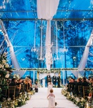 Flower Girl on Monogrammed Aisle
Photography: Harwell Photography
Read More:
http://www.insideweddings.com/weddings/magical-winter-wedding-with-luxurious-red-white-holiday-decor/1208/ wedding ceremony winter blue outdoor clear tent white drapery chandelier lights greenery gold runner
