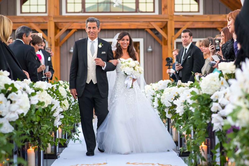 Aspen Bride %26 Father of the Bride
Photography: Brett Butterstein Photography
Read More:
http://www.insideweddings.com/weddings/incredible-tented-ceremony-barn-reception-at-ranch-in-aspen/860/ Bride in Carolina Herrera wedding dress walking down aisle with father in three piece suit Aspen