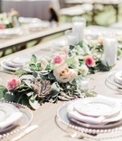 Garland Centerpiece with Succulents
Photography: Ether %26 Smith
Read More:
http://www.insideweddings.com/weddings/youtube-singer-megan-nicoles-romantic-outdoor-wedding-in-malibu/1163/ wedding reception succulent greenery candle votive blush pink rose flowers megan nicole youtube