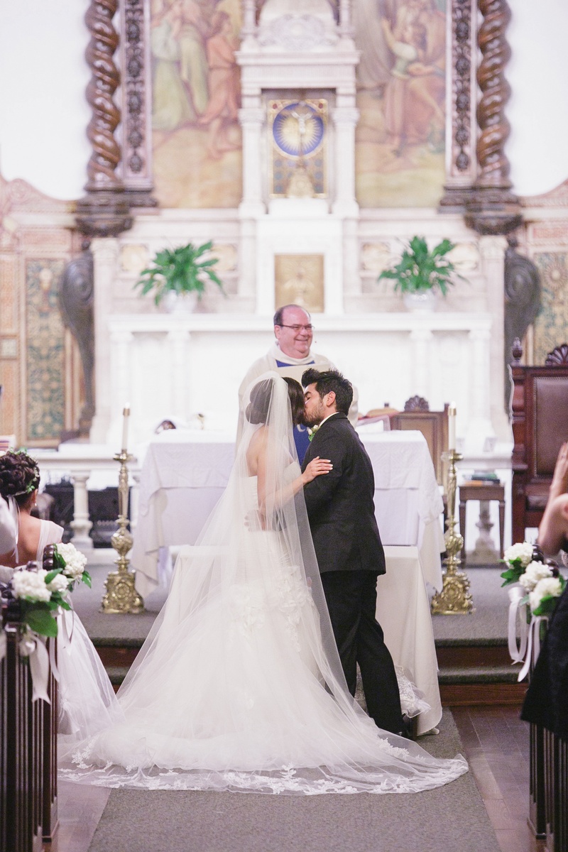 Spanish-Style Church
Photography: Jasmine Star Photography
Read More:
http://www.insideweddings.com/weddings/spanish-style-ceremony-outdoor-ranch-wedding-reception/504/ Bride and groom kiss at altar of Catholic wedding church