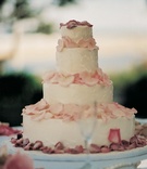 Four Layer Frosted Cake
Photography: Miki and Sonja Photography
Read More:
http://www.insideweddings.com/weddings/shabby-chic-garden-wedding-in-malibu-california/112/ Four tiers with white frosting and pink petals
