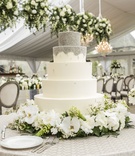 5-Tier White-and-Silver Cake, Flowers
Photography: Annette Navarro
Read More:
http://www.insideweddings.com/weddings/romantic-garden-wedding-with-white-green-motif-in-cincinnati/959/ 5 five tier white silver cake fresh flowers wedding reception cake beading chocolate cream cheese