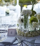 Multiple Arrangement Centerpiece
Photography: Dalal Photography
Read More:
http://www.insideweddings.com/weddings/movie-themed-wedding-with-pops-of-green/345/ Wedding centerpiece with many vases filled with white flowers