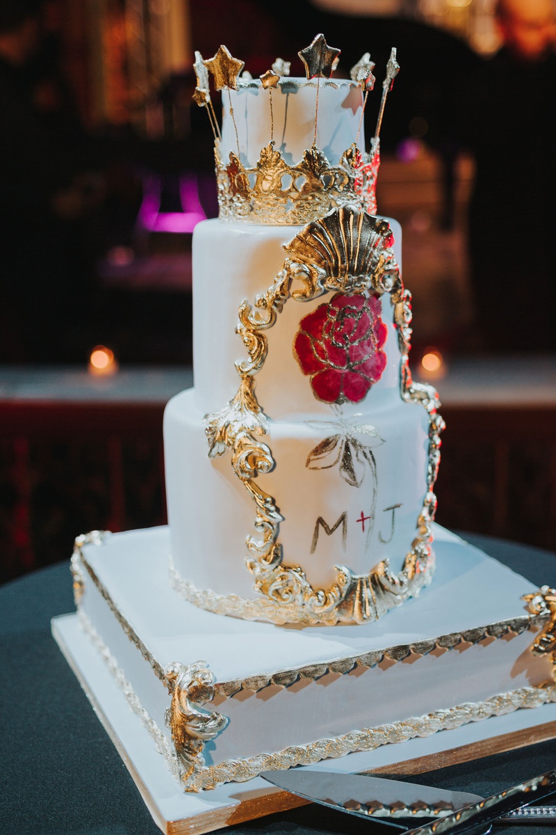 Magical Wedding Cake with Red Rose
Photography: Joel %26 Justyna
Read More:
http://www.insideweddings.com/weddings/dreamy-winter-destination-wedding-in-an-ice-castle-in-quebec-city/1270/ three layer wedding cake on white gold stand with hand painted flowers gold details crown