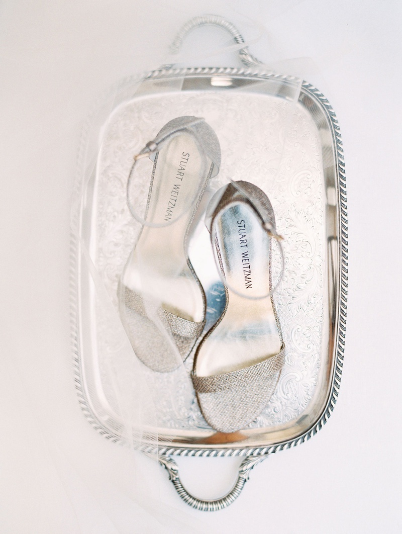 Glittering Silver Sandals on Tray
Photography: Mallory Dawn Photography
Read More:
http://www.insideweddings.com/weddings/outdoor-jewish-ceremony-luxe-reception-at-vibiana-in-downtown-la/1259/ wedding accessories stuart weitzman wedding shoes bridal heels silver glitter sandals ankle strap