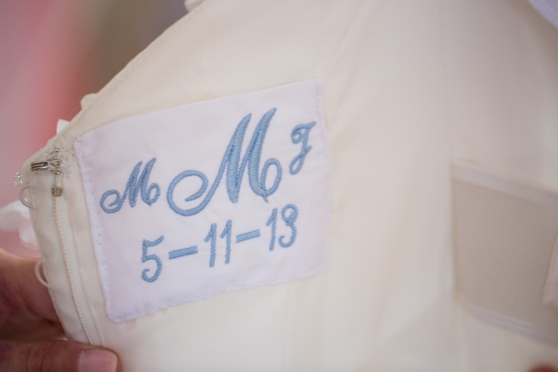 "Something Blue" Patch
Photography: Aaron Watson Photography
Read More:
http://www.insideweddings.com/weddings/classic-virginia-wedding-inspired-by-grace-kellys-elegance/511/ Monogram and wedding date woven into wedding dress