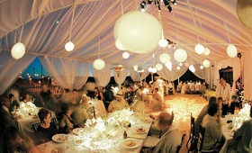 Paper Lantern Lighting
Photography: John Solano Photography
Read More:
http://www.insideweddings.com/weddings/tented-beach-wedding-in-malibu-california/24/ Evening reception decorations for beach tent wedding