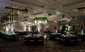Reception with Green %26 White Décor
Photography: Studio This Is
Read More:
http://www.insideweddings.com/weddings/whimsical-wedding-in-chicago-with-inspiration-from-national-parks/1272/ ballroom wedding reception round rectangular tables greenery white flowers candelabra ceiling decor