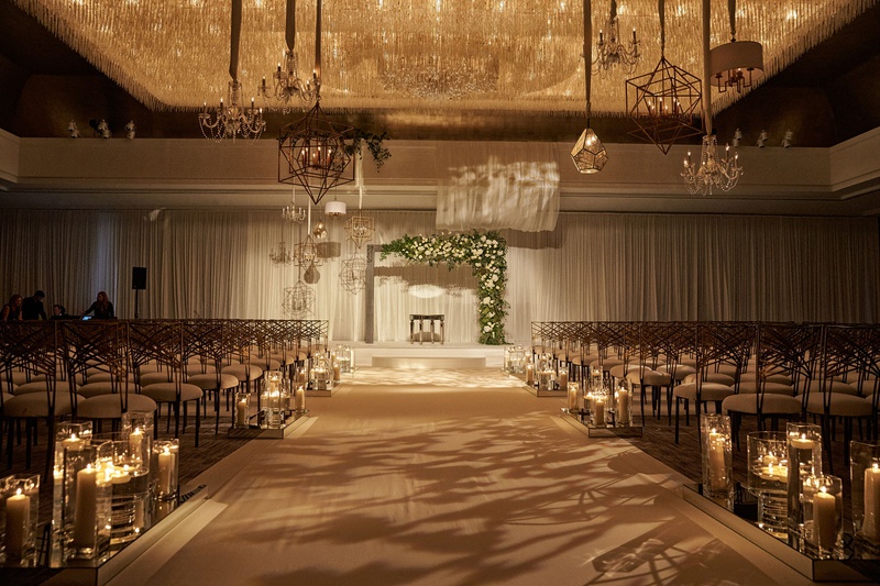 Wide Aisle at Indoor Ceremony
Photography: KingenSmith
Read More:
http://www.insideweddings.com/weddings/modern-romantic-wedding-with-glam-geometric-details-in-chicago/1171/ wedding ceremony chicago wide aisle candles geometric chandeliers modern asymmetrical arch ballroom