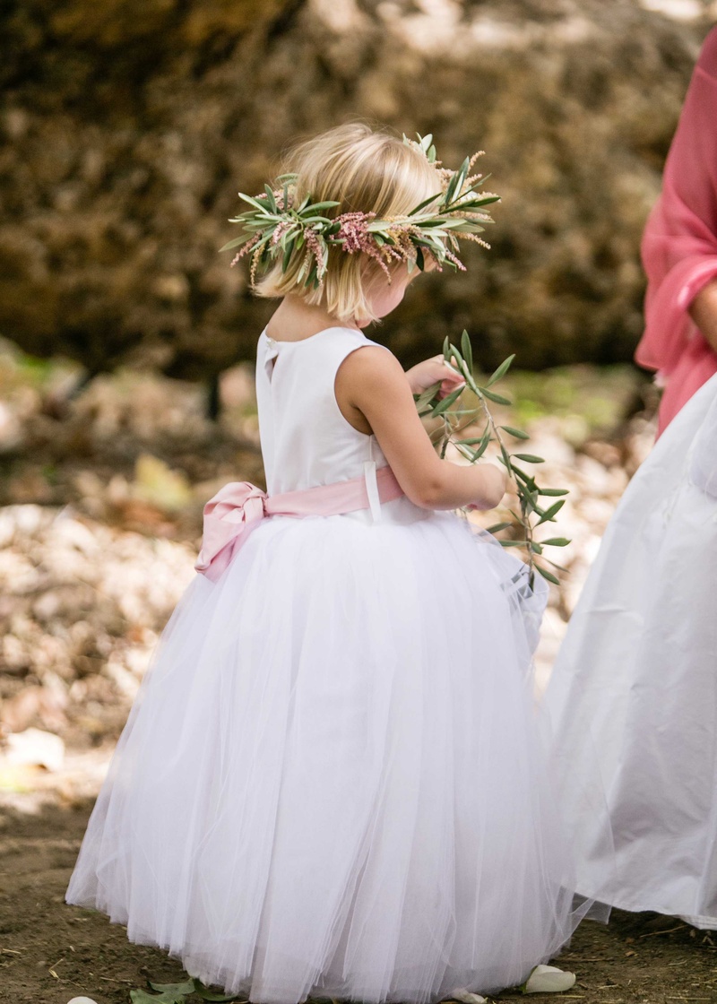 Flower Girl with Pink Bow Sash
Photography: Samuel Lippke Studios
Read More:
http://www.insideweddings.com/weddings/a-rustic-camp-themed-outdoor-wedding/908/ Flower girl with pink bow sash flower crown of olive leaves and pink flowers