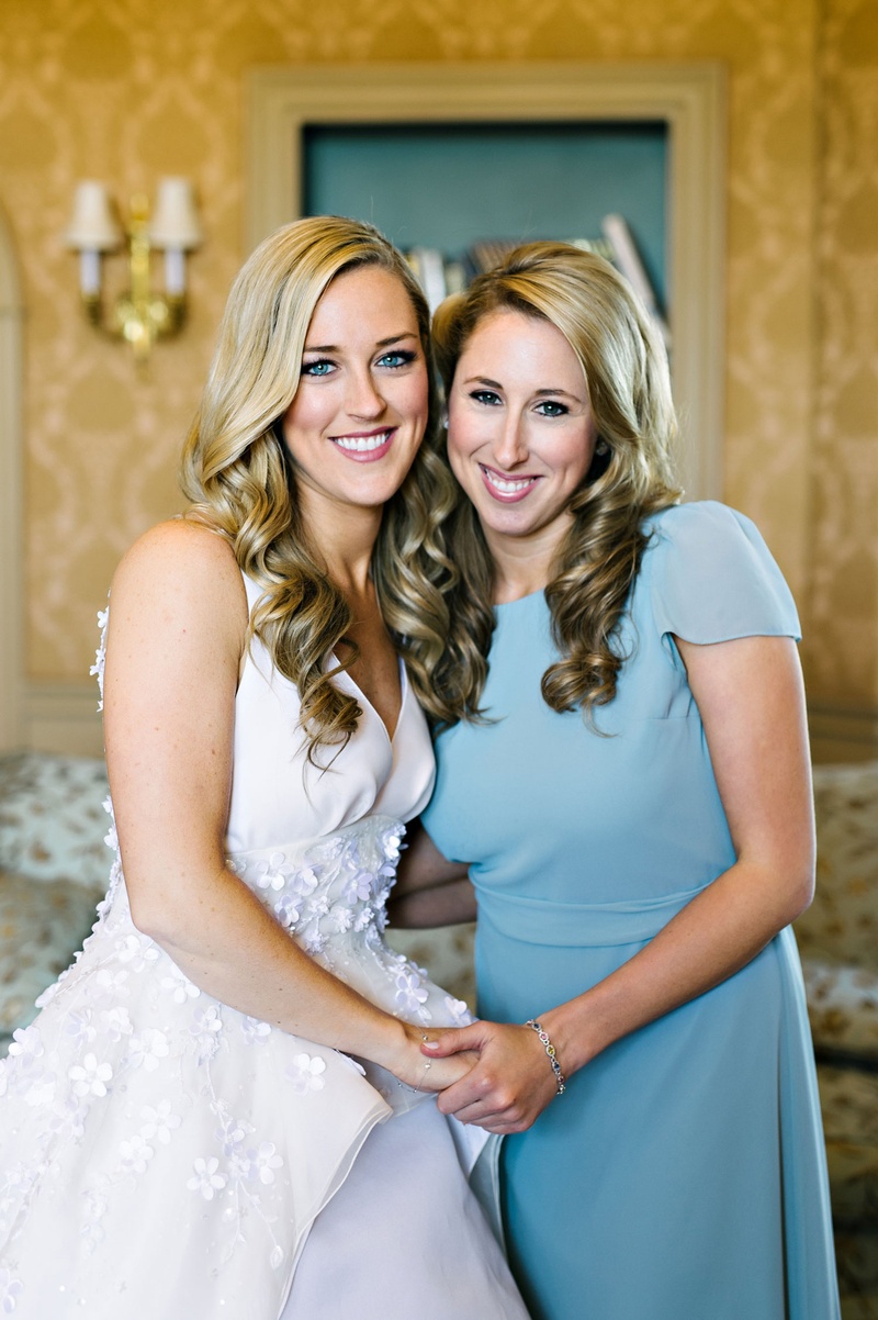 Bride with Maid of Honor in Blue
Photography: Dear Stacey
Read More:
http://www.insideweddings.com/weddings/sentimental-alfresco-ceremony-classic-reception-at-oheka-castle/1016/ Bride in Angel Sanchez wedding dress long hair curls with maid of honor bridesmaids blue dress short