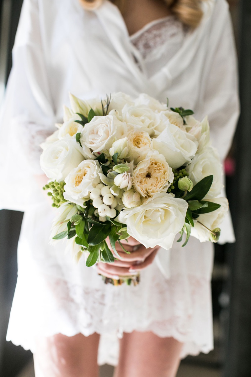 Elegant Ivory Wedding Bouquet
Photography: Samuel Lippke Studios
Read More:
http://www.insideweddings.com/weddings/tuscany-meets-rustic-california-outdoor-wedding-under-the-stars/1336/ bride in white robe holding ivory bridal bouquet garden rose rose berries greenery elegant classic