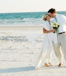 Casual Beach Wedding Couple
Photography: Dara Blakeley Photography
Read More:
http://www.insideweddings.com/weddings/a-sweet-beachy-north-carolina-celebration/267/ Bride and groom kiss on sand at beach wedding