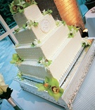 Square White Cake
Photography: Sean Randall Photography
Read More:
http://www.insideweddings.com/weddings/producer-david-brauns-wedding-at-natural-history-museum-in-atlanta/198/ Four layer wedding cake with orchids