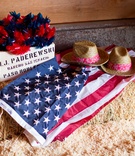 Patriotic Hats and Pinwheels
Photography: Elisabeth Millay Photography
Read More:
http://www.insideweddings.com/weddings/fourth-of-july-pre-wedding-party-in-central-california-countryside/655/ Wooden box of blue and red pinwheels on top of hay bale with american flag and cowboy hats