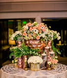 Rose Gold Escort Card Table
Photography: Laura Grier of Beautiful Day Photography
Read More:
http://www.insideweddings.com/weddings/romantic-timeless-garden-inspired-jewish-wedding-at-a-country-club/1292/ wedding reception round table acrylic escort cards gold rose gold honeycomb vases anemone rose