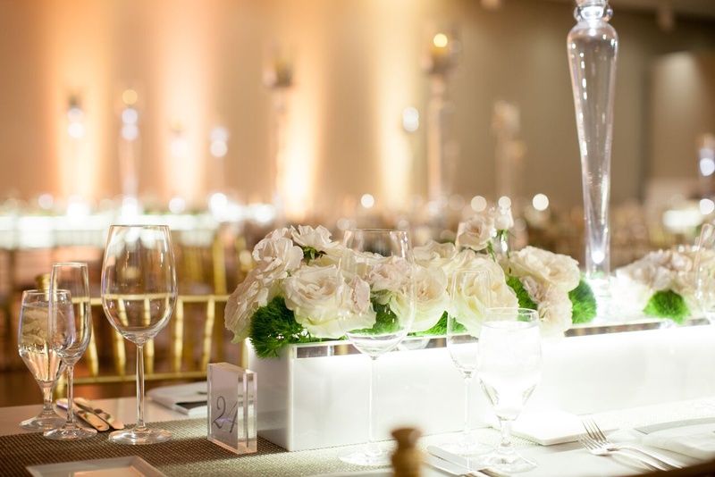 Marble Planters with Ivory Blooms and Moss
Photography: Eric Kelley
Read More:
http://www.insideweddings.com/weddings/summer-wedding-with-clean-color-palette-modern-design-in-chicago/776/ marble planters with white roses at modern museum wedding reception