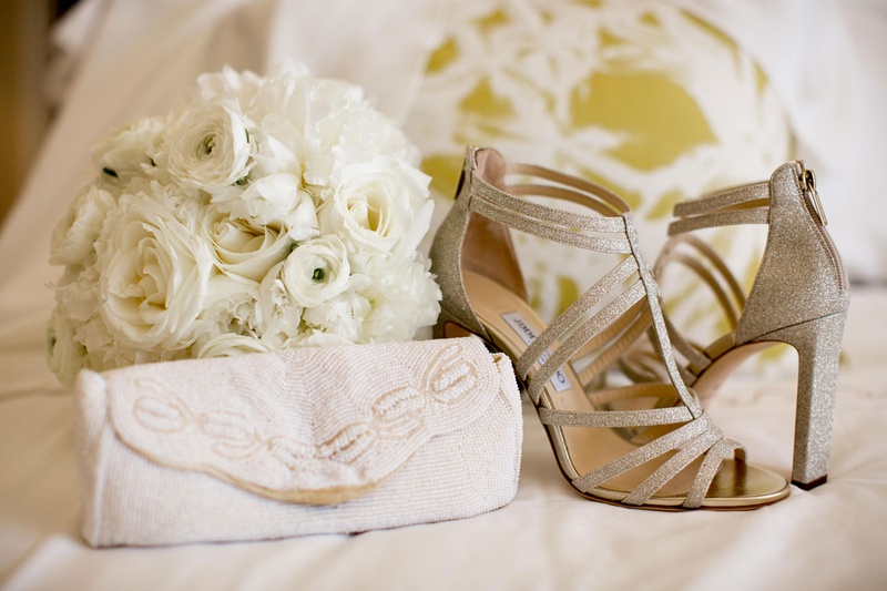 Sparkling Shoes %26 Beaded Clutch
Photography: Carrie Rodman Photography
Read More:
http://www.insideweddings.com/weddings/intimate-destination-wedding-with-classic-decor-in-palm-beach/1302/ glittery strappy jimmy choo bridal heels with white beaded bridal clutch purse