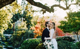 Bride and Groom Among Fall Foliage
Photography: Green Vintage Photography
Read More:
http://www.insideweddings.com/weddings/modern-country-club-wedding-with-baseball-inspired-details/1043/ bride in backless dress with lace sleeves, groom in tuxedo, fall foliage