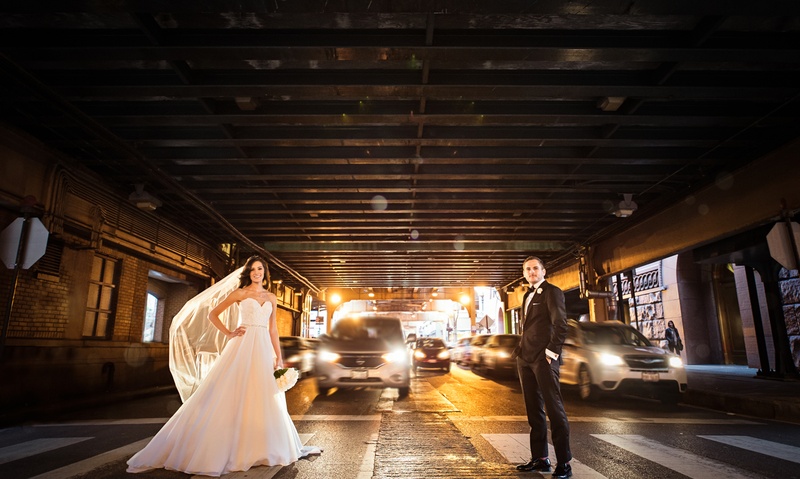 Bride and Groom in Chicago Crosswalk
Photography: Carasco Photography
Read More:
http://www.insideweddings.com/weddings/jewish-wedding-with-classic-ivory-and-gold-decor-in-chicago/983/ bride in essence of australia wedding dress, groom in bonobos tux, standing in crosswalk in Chicago