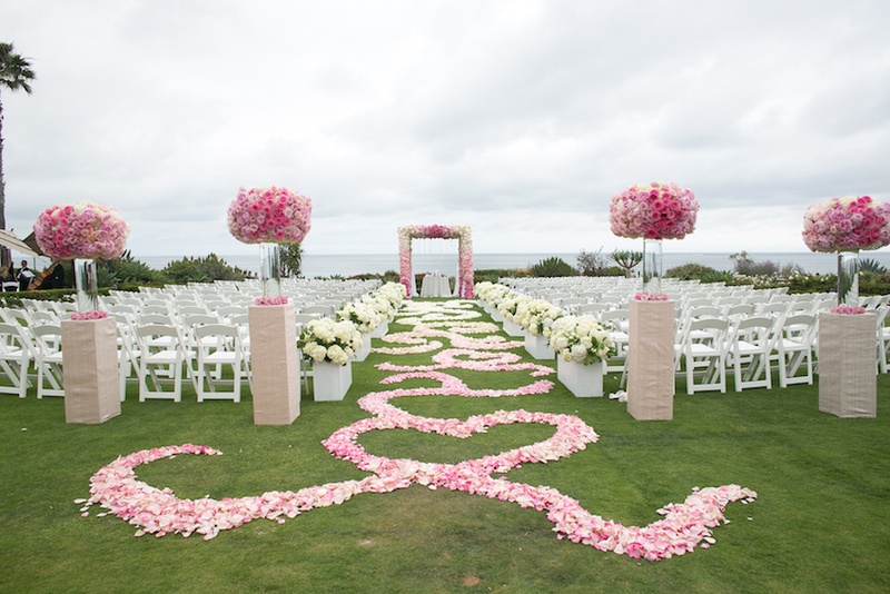Ombré Pink %26 White Flower Aisle
Photography: Marianne Lozano Photography
Read More:
http://www.insideweddings.com/weddings/pink-white-wedding-with-ombre-details-at-montage-laguna-beach/686/ Flower petal aisle with swirl design at Montage Laguna Beach wedding