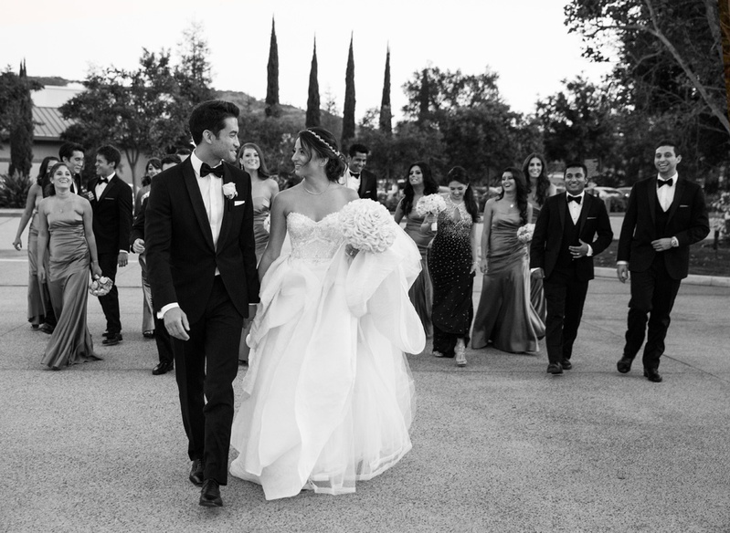 Bride %26 Groom with Wedding Party in Background
Photography: Jay Lawrence Goldman Photography
Read More:
http://www.insideweddings.com/weddings/elegant-white-lavender-ballroom-wedding-with-cherry-blossom-trees/710/ Black and white photo of bride in Monique Lhuillier dress and groom with wedding party