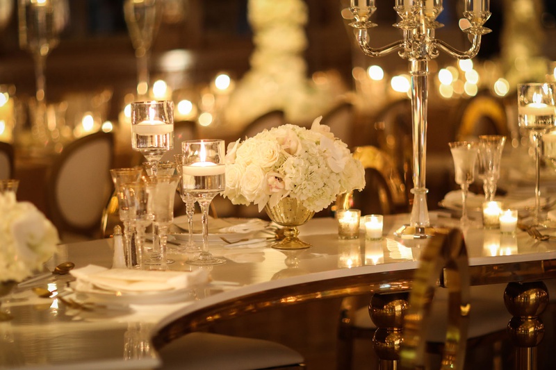 Serpentine Table with Low Centerpiece
Photography: Alain Martinez Photography
Read More:
http://www.insideweddings.com/weddings/opulent-luxury-wedding-with-white-gold-color-scheme-in-palm-beach/1375/ wedding reception at the mar a lago club white rose centerpiece floating candle and candelabra