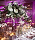 Long Table Centerpieces
Photography: Walters %26 Walters
Read More:
http://www.insideweddings.com/weddings/traditional-greek-ceremony-at-duke-chapel-lavish-reception/373/ Hurricane vases with candles and white flowers at reception