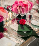 Elegant Place Setting
Photography: Troy Grover Photographers
Read More:
http://www.insideweddings.com/weddings/jet-setter-couples-modern-wedding-with-travel-inspired-elements/528/ Silver beaded charger with green napkin and pink flower
