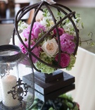 Garden-Themed Spring Florals
Photography: Sheri Whitko
Read More:
http://www.insideweddings.com/weddings/jewish-wedding-with-personal-details-and-a-whimsical-garden-motif/808/ pink flower, cream rose, greenery in branch sphere on table at wedding